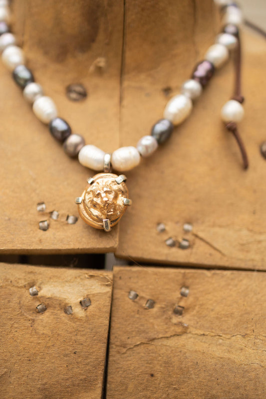 BRASS PRONG SET LION HEAD & PEARL NECKLACE