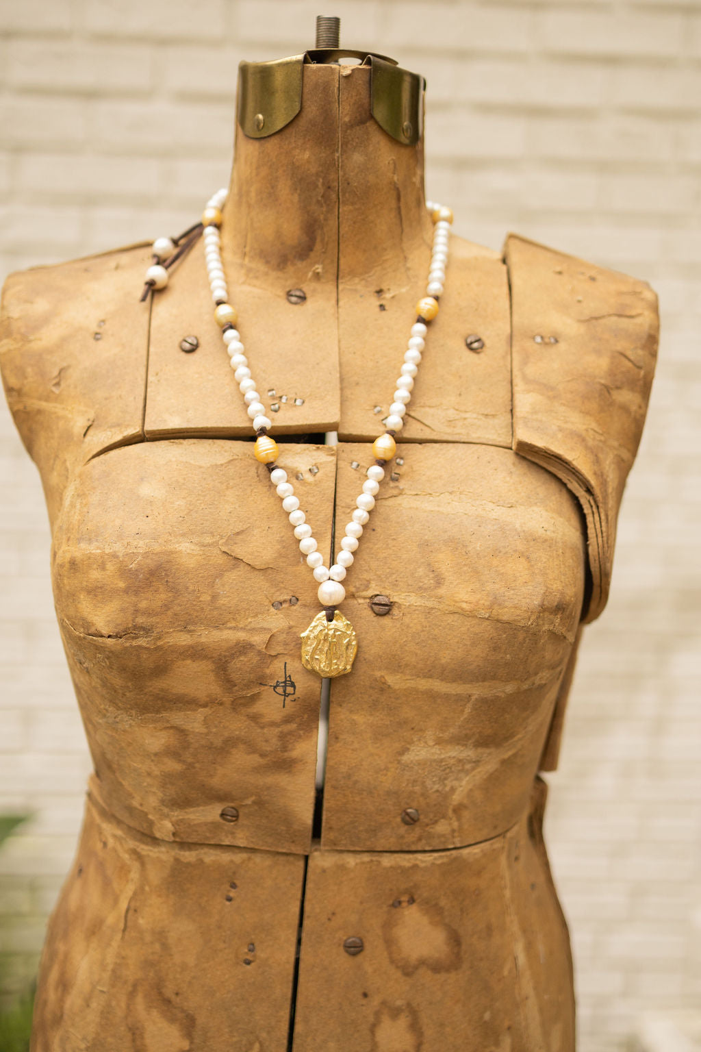 BRASS WARRIOR PENDANT & PEARL NECKLACE